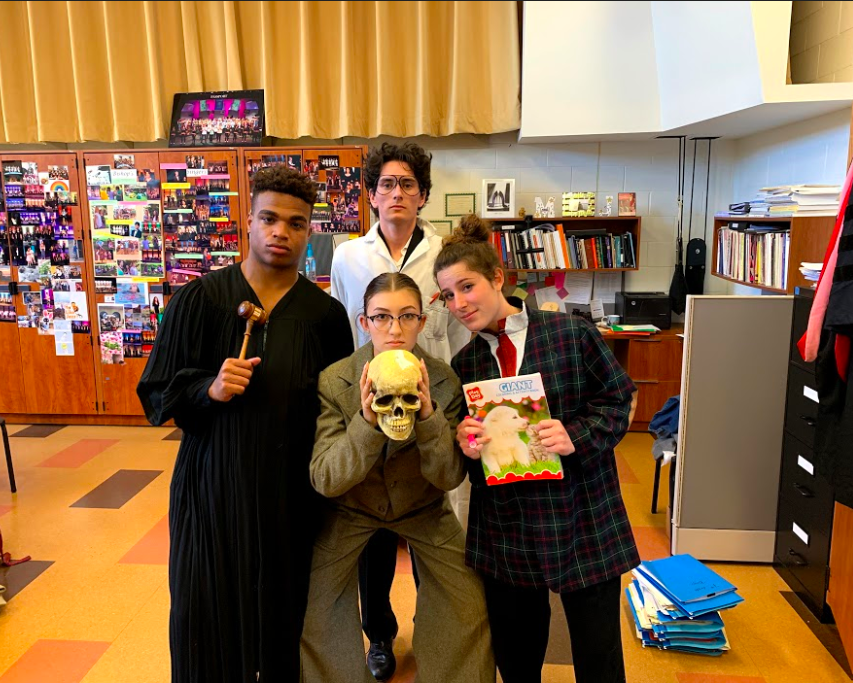 Seniors Gabe Thomas, Amea Wadsworth, and Cat Paul (bottom) pose with Dylan Lödl (top) in a backstage photo. All four played government officials tasked with keeping the rampant corruption of their town a secret from the government inspector.  
Photo courtesy of the Bishops school Flickr page