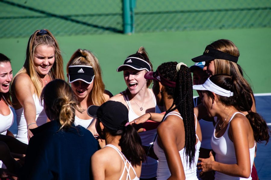 The team gathered for an energetic cheer before their match. 

