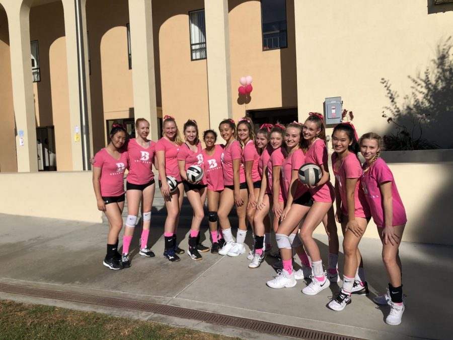 The JV volleyball team smiles for the camera, ready for a fun match for a great cause.