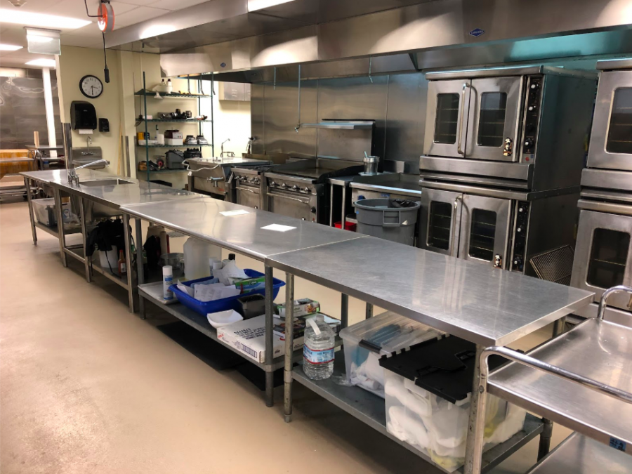 Two of the cafeteria’s main rooms include multiple ovens, stoves, mixers, and tools. 