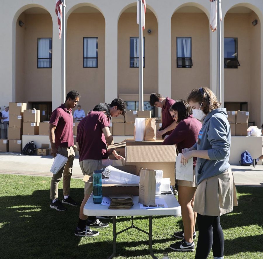 As Seniors packed products diligently into packs, the boxes outside the library grew. 