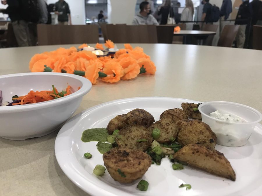On November 3, the cafeteria made potatoes with an Indian twist and a pickled cabbage salad to celebrate the Indian holiday Diwali. The orange flower centerpieces are one of the many decorations that were placed around the cafeteria that day.