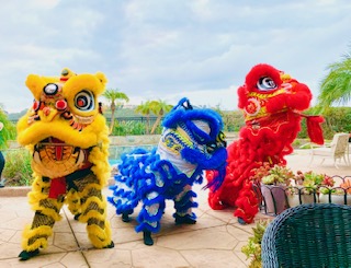 These colorful lions depicted are commonly seen dancing during Lunar New Year. Inside are two people controlling the legs and head. They are often accompanied by drums, cymbals, and a gong.