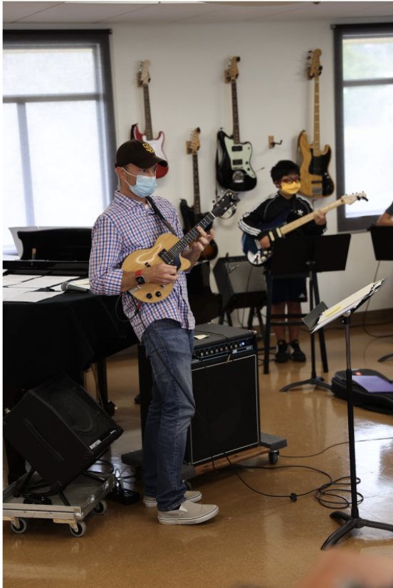  During the 2021 summer session, Mr. Robert Anderson led Bishop’s Rocks, teaching younger students how to play the electric guitar. 