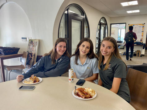No matter the cuisine, students enjoy spending time with each other during the school day over a meal. Juniors (pictured from left to write) Kylie Larson, Bella Gallus, and Lily Gover smile over plates of enchiladas and Spanish rice.