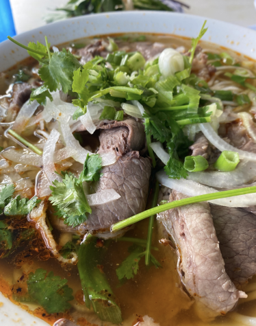The thick noodles, thinly sliced beef, and tons of onions and chili oil at Pho La Jolla make for a savory dish that warms you up in seconds.
