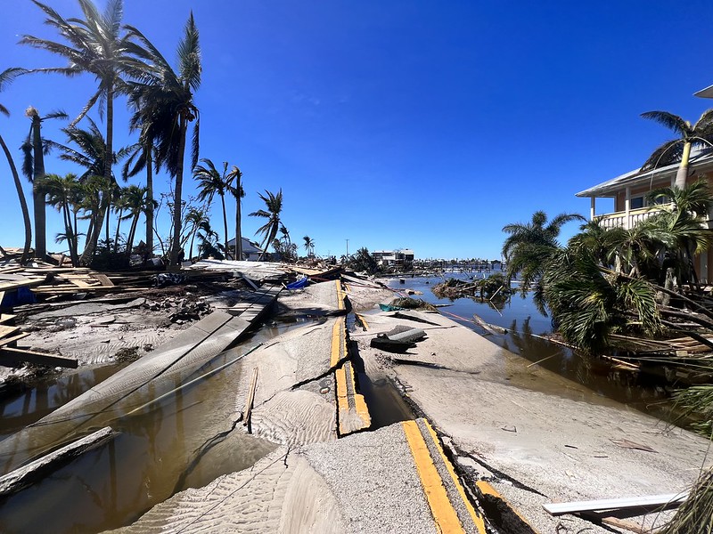 Debris and trash line the sides of the damaged roads in Fort Myers, FL, the streets specifically affected by the deadly Hurricane Ian.