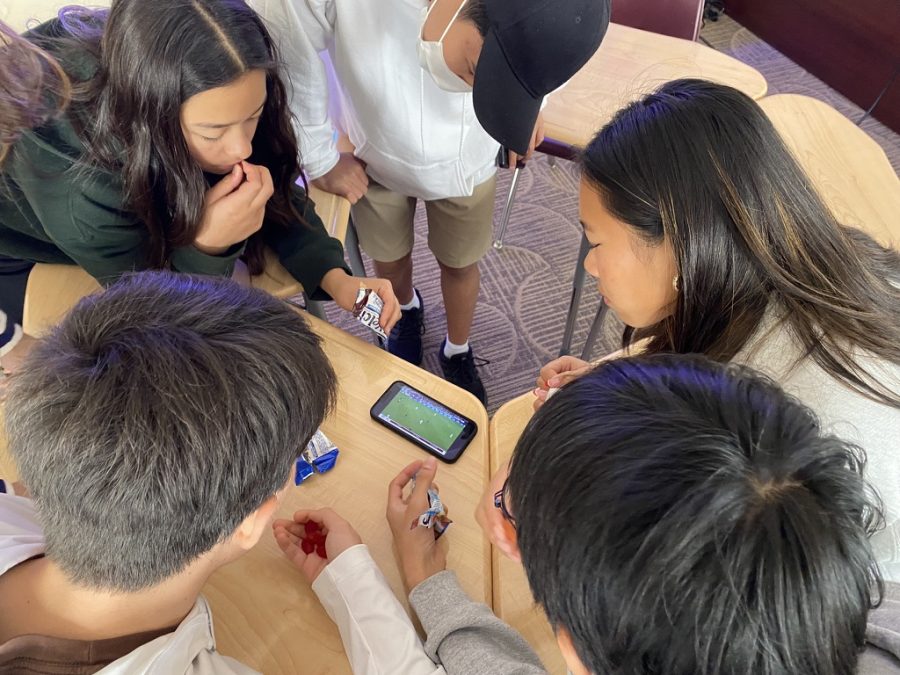 On November 29, students rushed to watch the World Cup match between The United States and Iran at 12:09 P.M. Sophomores Sierra Lever, Gabby Gaspar, Seungbeom Baek, Tommy Michael, and Noan Cheng (‘26) crowd around Tommy’s phone during class.