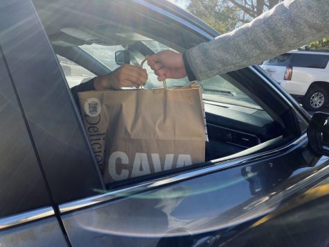 Students meet their Dashers or UberEats drivers at the front or back of the school to pick up a variety of tasty goods.