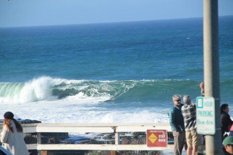 People crowd the La Jolla Cove on Friday, January 6, 2023, as waves up to 25 feet are breaking for one of the first times ever in the popular diving spot’s history.

