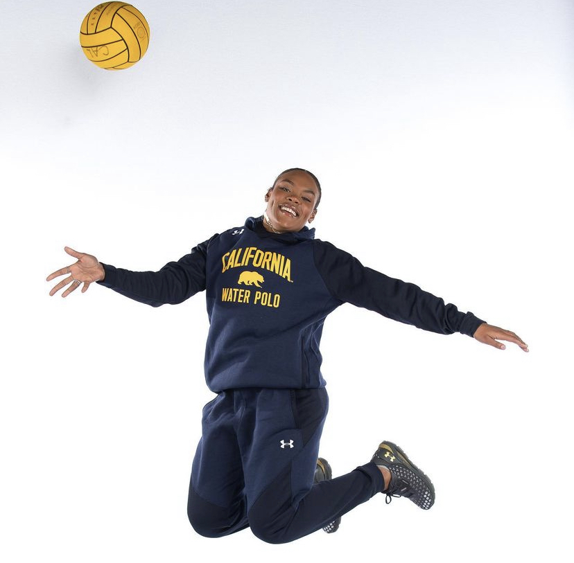 Coach Georgia Gilmore (‘17)  jumps for joy before playing her last season at UC Berkeley in Spring of 2022.