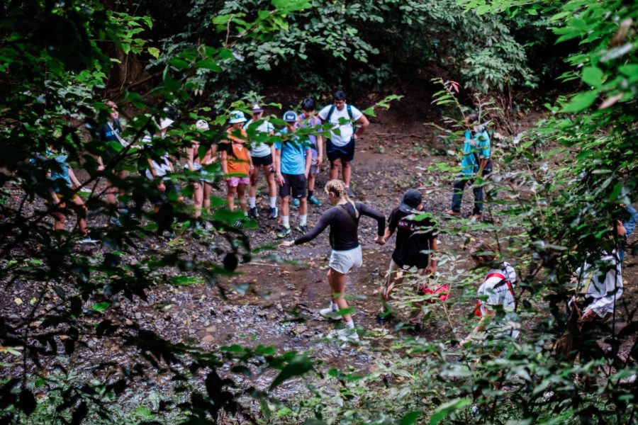 Anna Balsdon (‘24) makes her way across a stream on a trek through West Bali National Park.