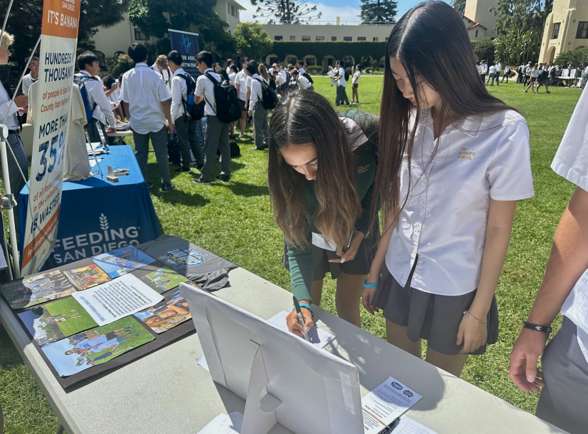 Many students like Suriya Bowen (‘25) (left) and Sophia Bao (‘25) (right) signed up for service clubs on September 12, 2023. Students swarmed booths as service club leaders explained and pitched their clubs.