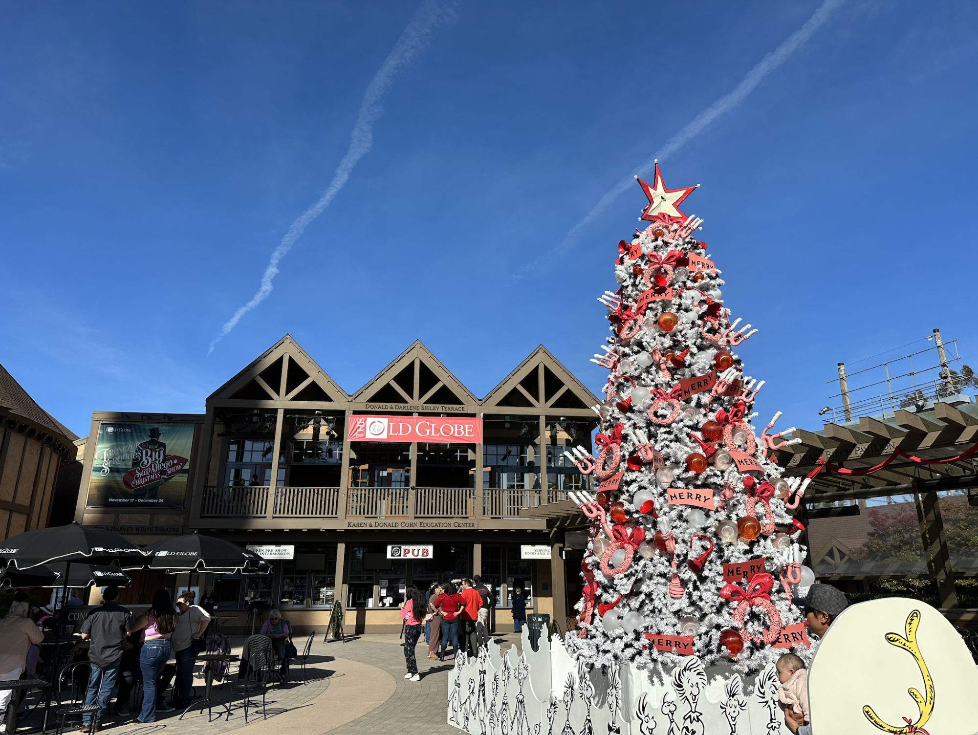 The big tree stands proud with red and white “who-like” decorations in front of the theater for kids to take pictures.