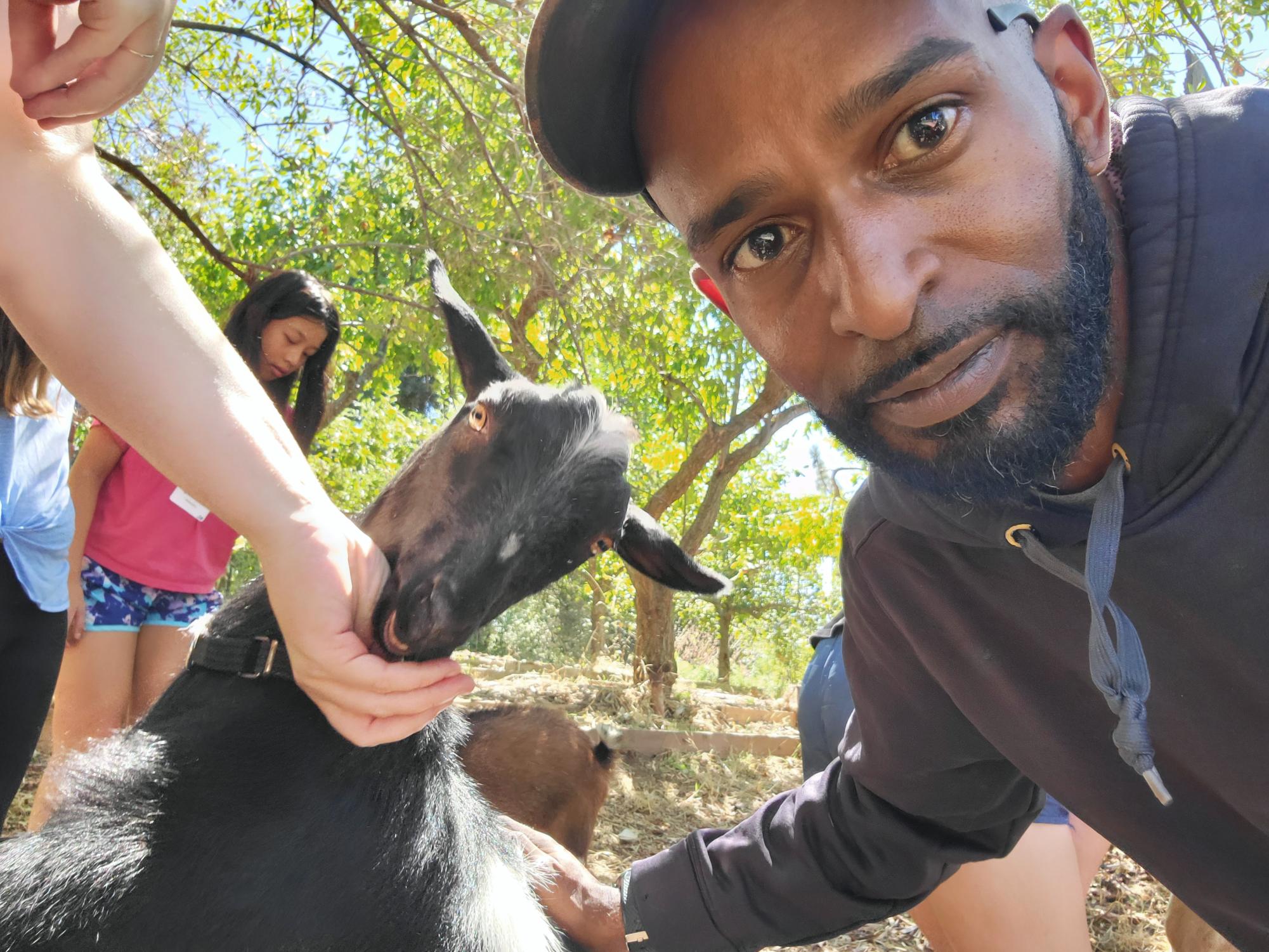 In 2023, Mr. Bacon accompanied the seventh graders to their retreat in Julian, where they fed goats in the barn. 