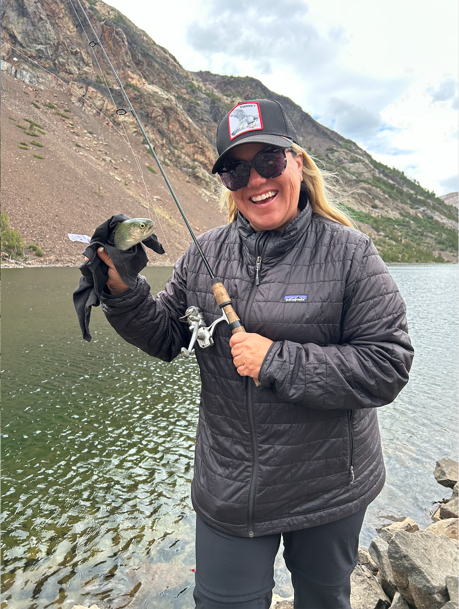 Mrs. Young proudly displays her fresh catch from her family’s backpacking trip in Yosemite