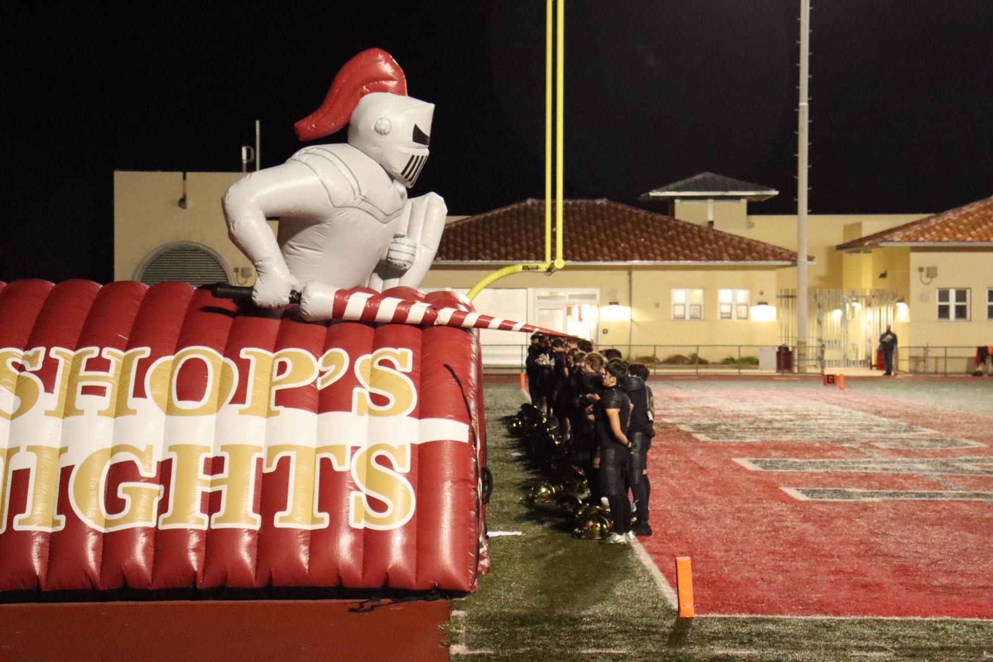 Just moments before the game the Bishop's Knights football team lined up at the end of the endzone taking in the meaningful singing of the national anthem, signaling the start of yet another battle for victory. 