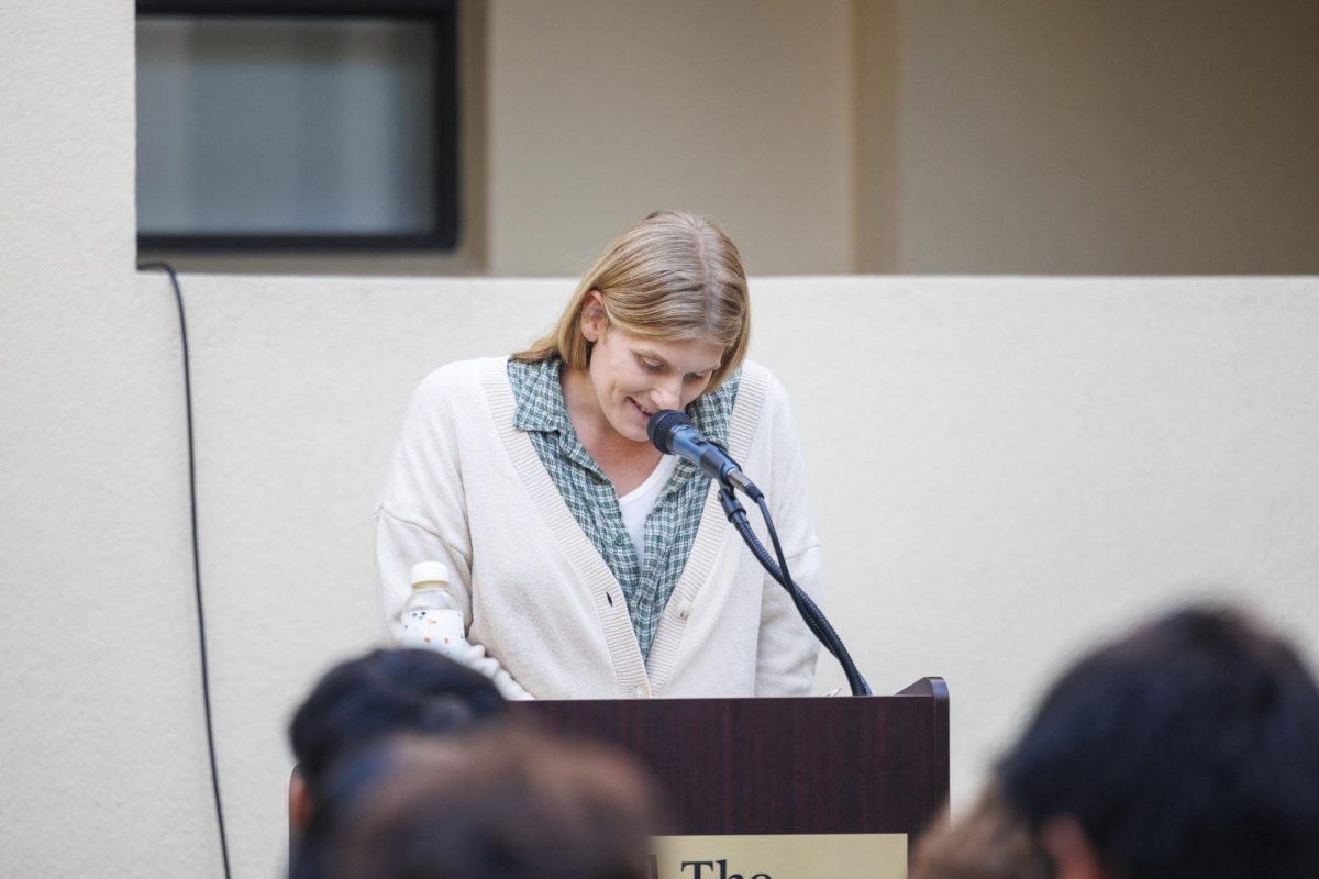 Jos Charles selecting a poem to read from her collection a Year and other poems
