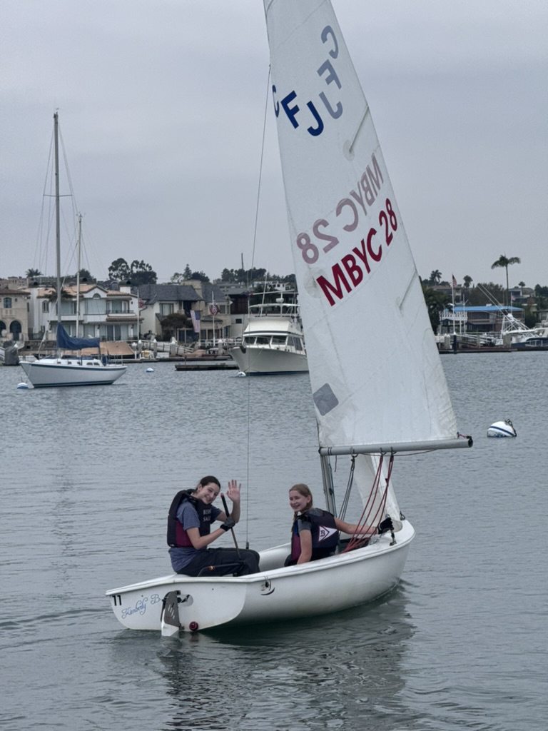 Freshmen Sarah Balfour and Mina Ogden sail the CFJ (Club Flying Junior) at practice.