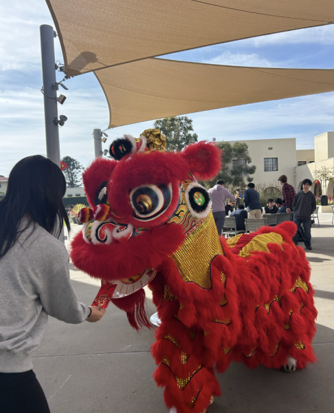 Angela An (‘27) said, “Feeding the lion a red envelope is one of my favorite activities that we have during the week because it’s an exciting and simple way that people can participate in the traditions of Lunar New Year.”