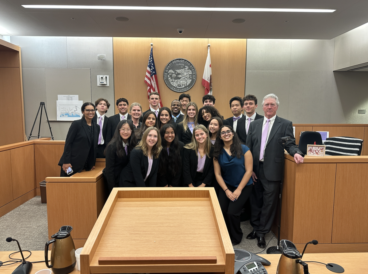 Back row (left to right): History Teacher and Mock Trial Coach Ms. Priscilla Wrosch, Reyn Harmon (‘25), Kiran Dhupa (‘25), Ben Brown (‘25), Judge Roderick Shelton, Nason Li (‘25), Lukas Minasian (‘26), David Lai (‘25), Dominic Simopoulos (‘26), and Attorney Coach Tim Barry. 
Middle row (left to right): Teacher Coach Ms. Nicole Uhland, Claire Stallings (‘26), Sophie Arrowsmith (‘26), Audrey Donnelly (‘26), and Riley Ross (‘26).
Bottom row (left to right): Claire Li (‘28), Bella Combs (‘25), Nirvana Shiwmangal (‘25), Lyla Beamer (‘25), Grace Ebel (‘27), and Aashi Lohchab (‘26).
After the first round, the Bishop's Mock Trial team took a group picture with the judge. 