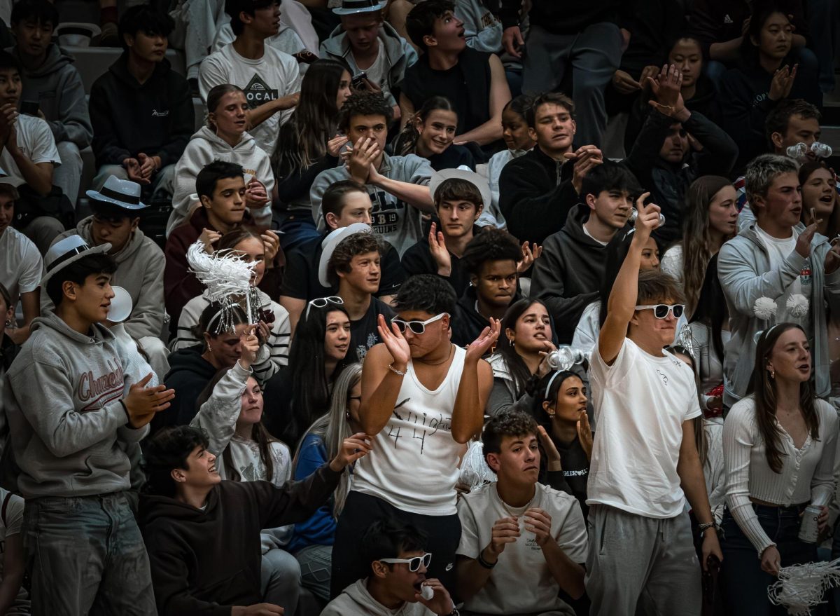 The Dungeon and Bishop’s students, like Seniors Kiran Dhupa and Timothy LaBrucherie, showed up to support the Boys Basketball Team as they faced off against Francis Parker on Friday. The theme was whiteout.
