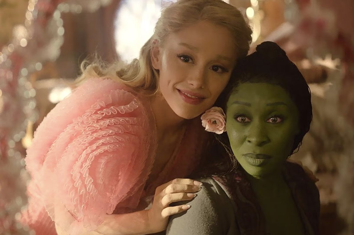 Glinda (Ariana Grande, left) helps Elphaba (Cynthia Erivo, right) transform through clothes and makeup as they perform a song much loved from Wicked the musical: “Popular.”