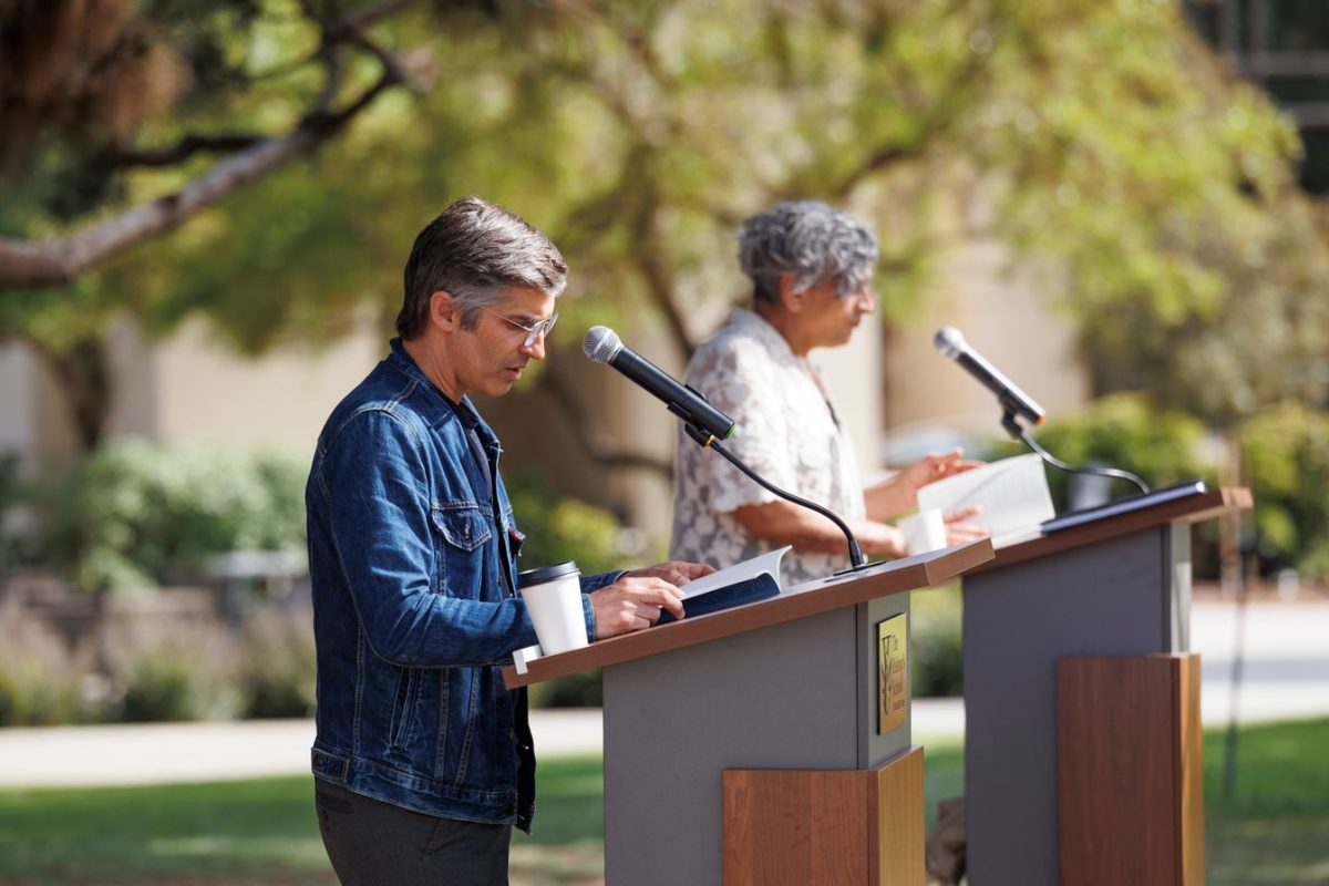 While Blas Falconer (left) reads, Kazim Ali (right) scans his collection for a poem that complements Falconer’s. The two alternate, engaging in a conversation through poetry.