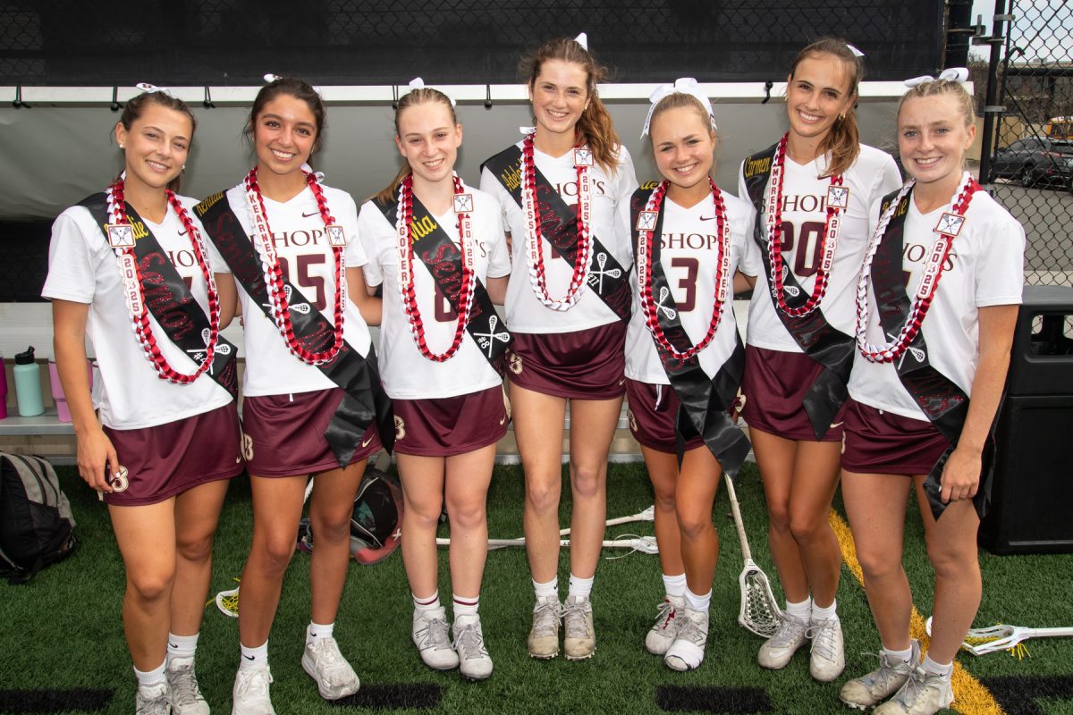 After the game, seniors Natalie Marvin, Kendall Kearney, Mia Gover, Adelaide Kessler, Alex Pfister, Carmen Morrera, and Laine Jefferey stand together after getting their leis from walking through the Knights tunnel after their Senior Night game. 