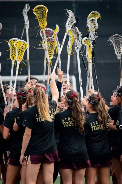 The Girls’ Lacrosse Team captains (Natalie Marvin (‘25), Alex Pfister (‘25), Laine Jeffery (‘25), and Kendall Kearney (‘25)) lead the cheer before their victory against Canyon Crest Academy.