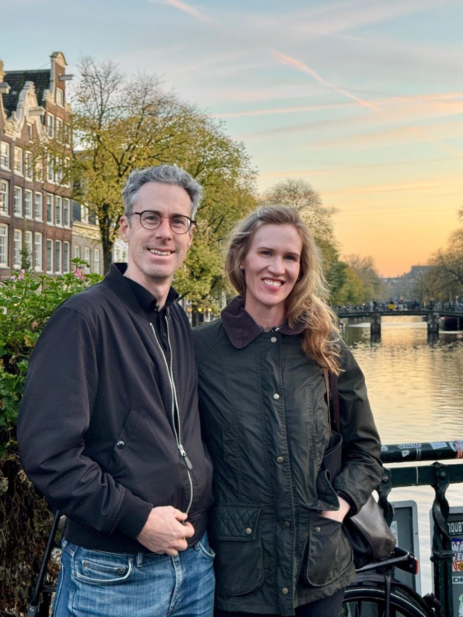  Smiling ear to ear in “pretty much [their] favorite city,” Dr. Clark and her husband Chris stand in front of a typical but no less breathtaking frame of Amsterdam.