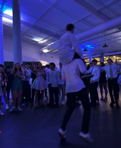 As the night drew on, students formed a dance circle, with laughter echoing through the venue and the DJ’s music pulsing in time with flashing lights. Cheers erupted as one group after another jumped in, moving to the beat and hyping each other up. Some showed off practiced choreography, while others just went for it, jumping on each other’s shoulders and falling. Students from all grades – like like Jose Leon (‘28) – ran into the center with friends showing off their dance moves to popular songs, like Dancing Queen.