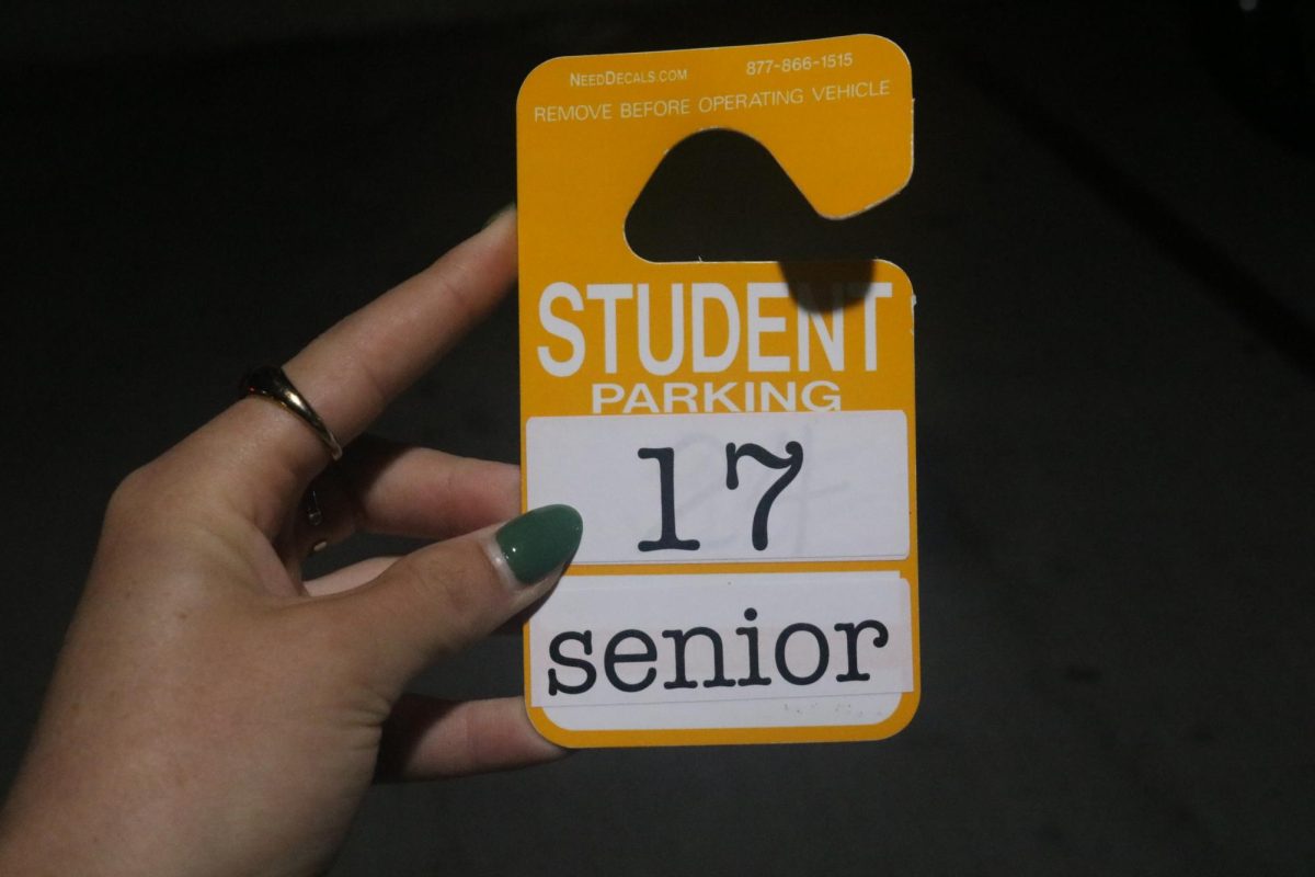 When assigned a spot in the garage, students are given a parking pass to put on their mirror or dashboard. The number on the pass corresponds with the number on the parking spot.