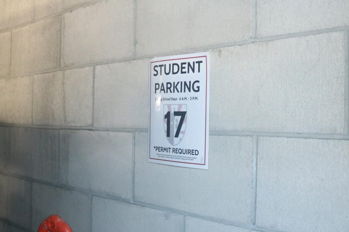 The back row of parking spots in the garage is dedicated to students. Each spot has a sign with a number that corresponds to a specific student’s parking pass.