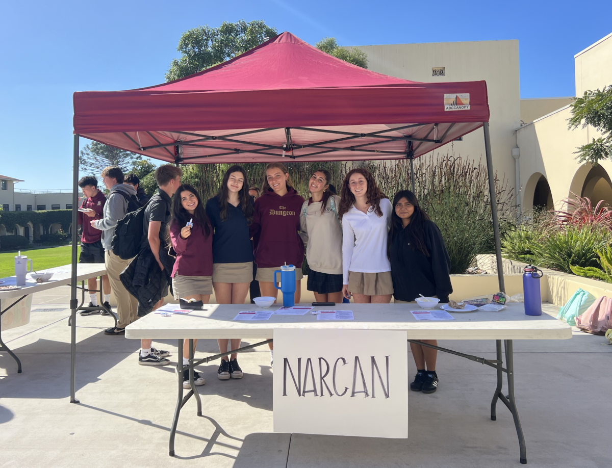 Senior Peer Support members (left to right) Isabel Zorrilla, Juliette Eastman-Pinto, Lotte Lightner, Gabby Gallus, Addie West, Paula Venancio, all stood at the Narcan booth at lunch on the terrace on October 24, teaching fellow Bishopians how to use Narcan.