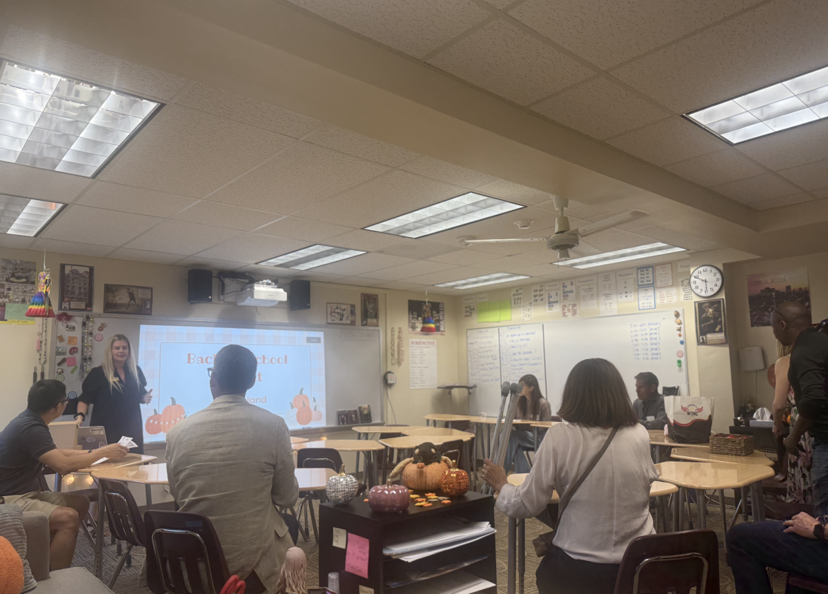 On Back to School Knight every year, the advisory block takes up the most amount of time — 20 minutes compared to other classes’ 10. Depicted above is Ms. Nicole Uhland, a 10th grade advisor and Class of 2028 Sponsor, presenting a slideshow for her advisory’s parents this year, which included light-hearted games such as “Would You Rather”. 