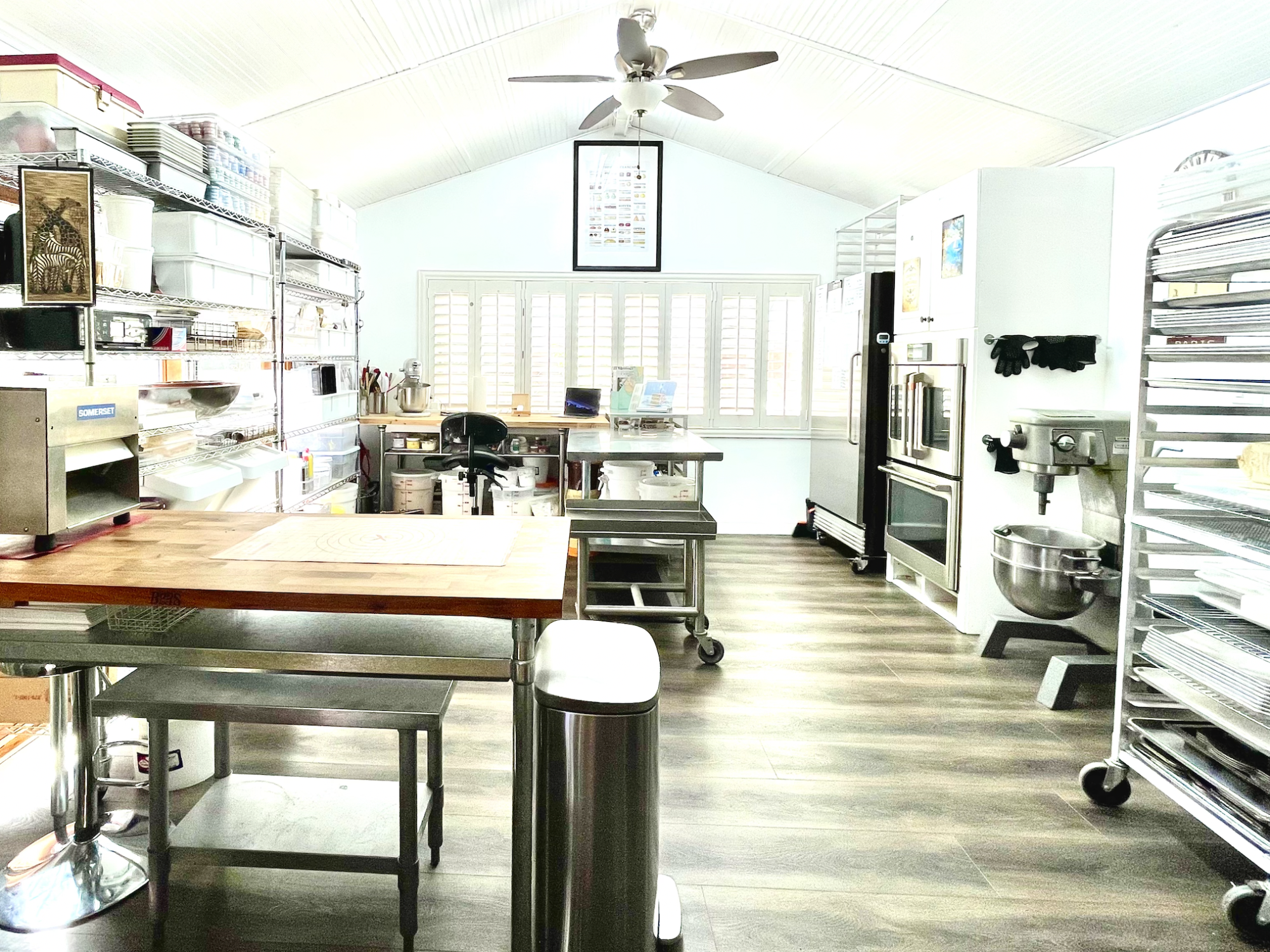 This is Mrs. Quena Nieto-Marco’s home bakery, where she makes all of the cookies. Her favorite machine in her bakery is the laminator, on the table on the left, which is used to make croissants by compressing the dough and rolling it out to create many layers.