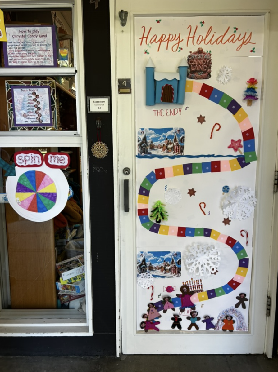 Inspired by the Candy Land board game, Math Teacher Mrs. Jessi Chrystal’s door featured a colorful game-board design complete with a spinning wheel and decorations crafted entirely from materials found on campus. Joy Xu (‘26), one of Mrs. Chrystal’s 12th-grade advisees, described how the group relied entirely on materials already available on campus. “We actually didn’t buy anything,” she said. With access to supplies from the Creative Sciences space, students used construction paper, Velcro, and other materials to bring the Candy Land board game to life, winning them the contest. The decorating process itself became a collaborative effort for the Chrystal advisory. “Ayanna made the spinning wheel, Izzy and I made the trees, Yina made the candy canes, and everyone made their own gingerbread man,” Joy explained. They were determined to win after coming so close the previous year. “It was our last chance to win, and everyone was super excited,” Joy added. And they won — taking first place!
