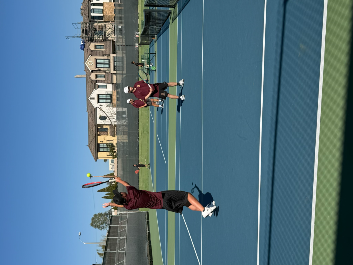 During pre-match warmups for the Varsity Boys Tennis match against Pacific Ridge on March 12, from left to right, Captain Christopher Tao (‘26) and Captain Tyler Chang (‘26) warmed up their volleys for a doubles game against two Pacific Ridge players.