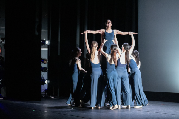 Dancers lift junior Maya Krishnan during a group performance to the song Unsteady by X Ambassadors in Defying Expectations. Reflecting on the close-knit dynamic of Performing Dance Group, Maya said the program’s multi-grade community is what makes it so meaningful: “When I was in ninth grade, I learned from everybody that was older than me,” she said. “They passed down all of their knowledge.”